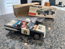 VINTAGE TIN ICHIKO FRICTION DRIVEN POLICE DEPARTMENT CAR W/ROTATING GUN  LIGHT.