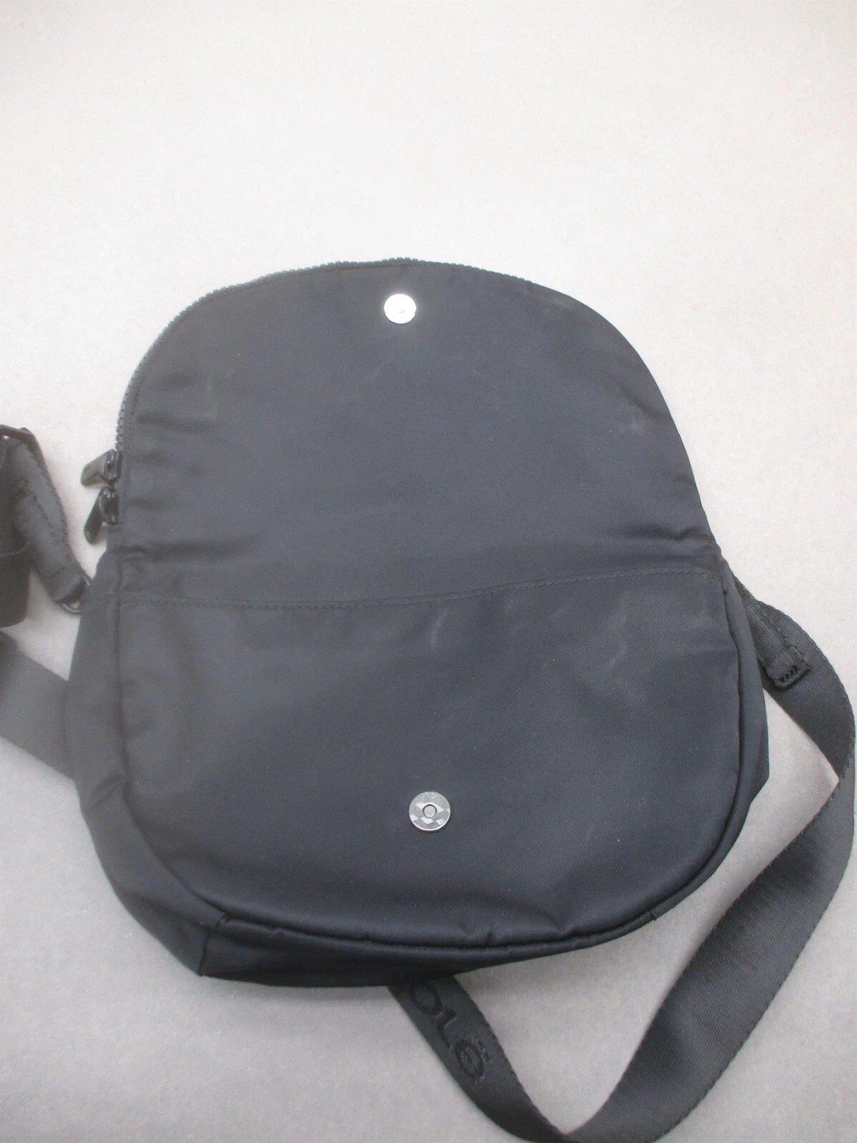 lole back zip pocket snap crossbody 