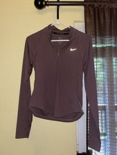 Nike Women s Purple Solid Athletic Fit 1/4 Zi...