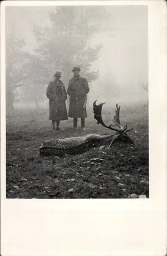 Photo two hunters, killed deer - 11229541