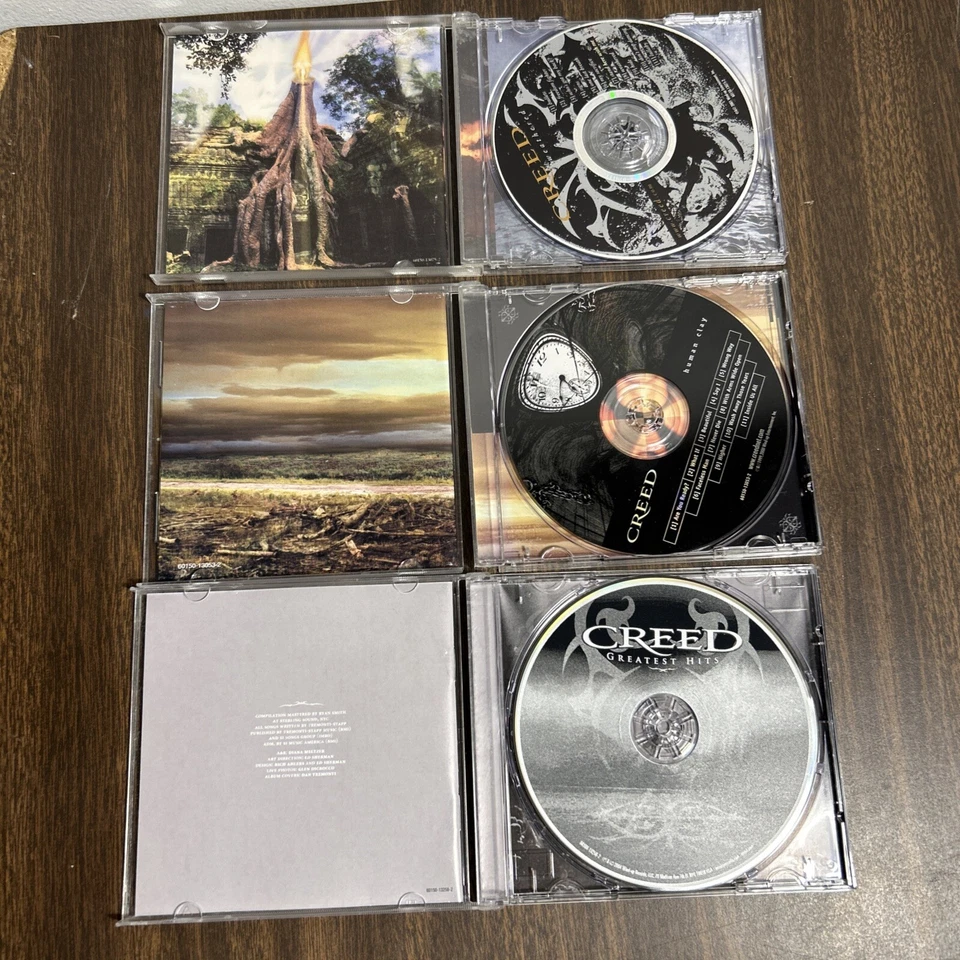 Lot of 3 CDs from Creed Human Clay, Greatest Hits, and Weathered - Image 2 of 3