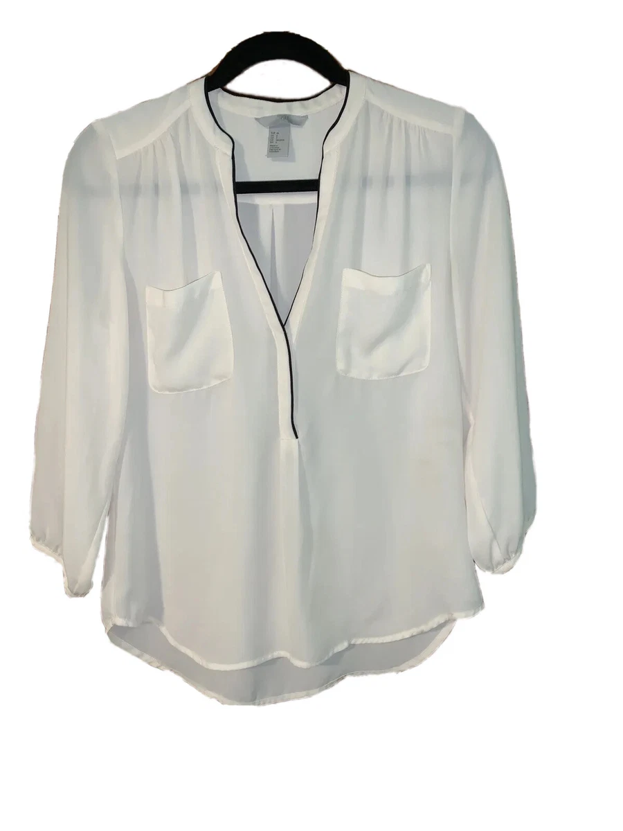 cream blouse with black trim