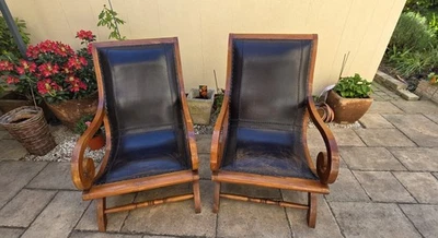 Paire de fauteuils vintage style colonial, en cuir véritable patiné et bois... - Photo 1/4