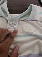 Vintage 80s Adidas striped pullover sweatshirt featuring a retro trefoil logo...