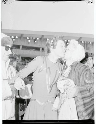 Pretty American skater Tenley Albright receives victorys kiss fro- 1956 Photo
