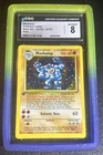CGC 8 Machamp 8/102 Base Set 1st Edition Holo Pokemon Card