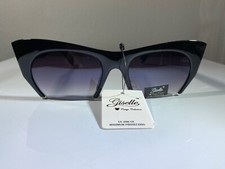 Women's cat eye style sunglasses with purple lenses and blue animal print arms