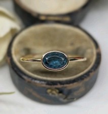 9ct Blue Spinel Stacker ring in yellow gold.
