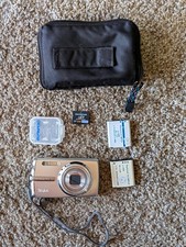 Olympus Stylus 1010 Silver 12.0MP Digital Camera Bundle w/ 2GB xD Card Case