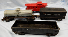 A collection of vintage Lionel O gauge train cars from the early 1950s.