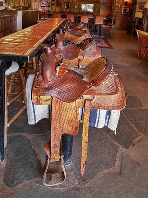 a, Unusual barstools made of actual horse saddles at the White Stallion Ranch