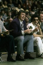 Head coach Tom Heinsohn Boston Celtics is watching the action from- Old Photo 1