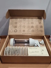 The Pampered Chef 1525 Cookie Press with 16 Cookies Design Discs