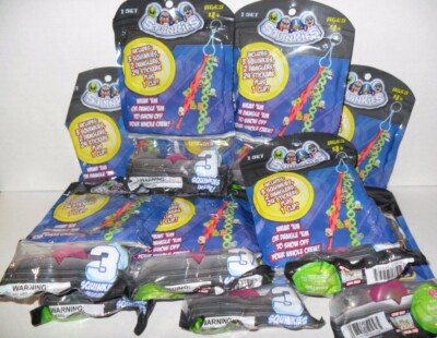 SQUINKIES WEAR EM OR DANGLE EM MONSTER LOT OF ((12)) NEW SEALED PACK'S
