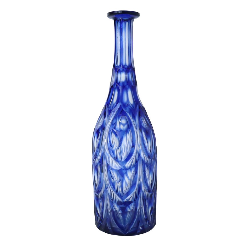 Deep cobalt Czech Bohemian cut crystal with intricate faceting — the kind of piece that looks like a sapphire sitting on your shelf.