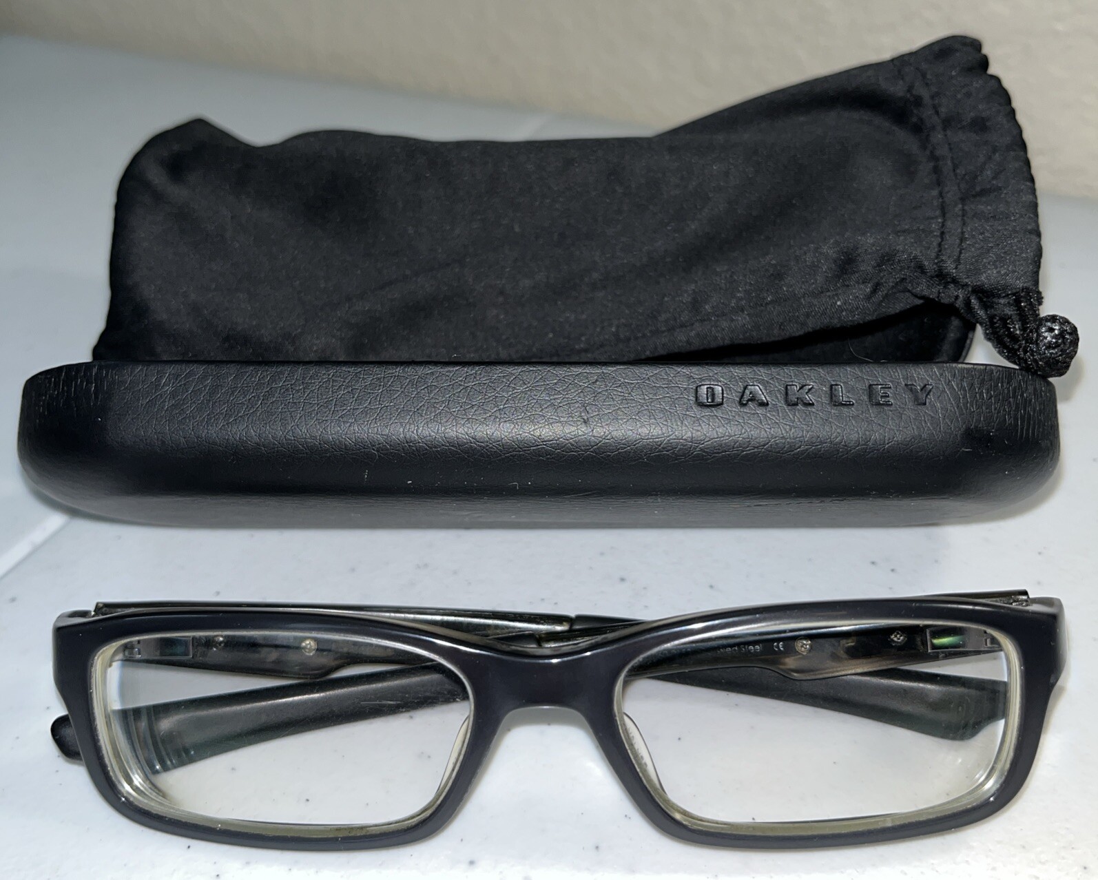 SAOLA Oakley Bucket OX1060 0153 montatura per occhiali da vista grigio lucido nero solo custodia e calza