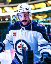 Dylan DeMelo Hitting Warmup Pucks Winnipeg Jets 8x10 NHL Hockey Photo