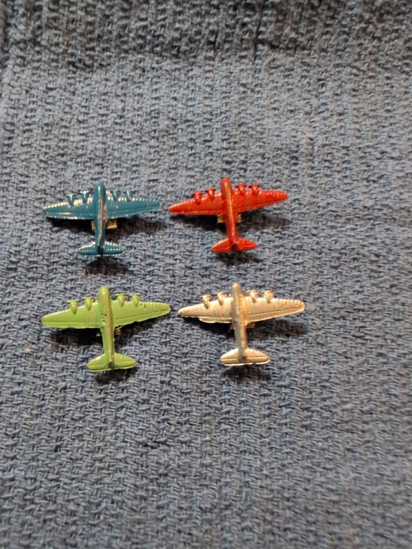 4 VINTAGE METAL AIRPLANES WITH  MAGNETS On The Back Side Of Of Each Of THEM.