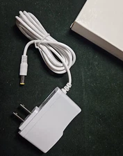 AC/DC ADAPTER OUTPUT: 12V 2A INPUT: 100-240V 50/60Hz MODEL: HXN 1220 FEMALE JACK