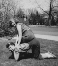 1950s Pretty Women Playful Pose Outdoors Grassyard Friends Smiling