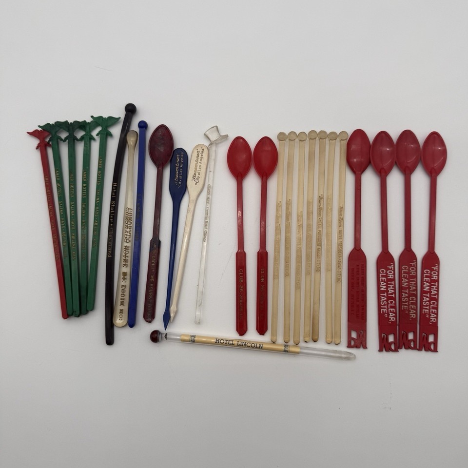 A lot of 27 mid-century hotel advertising swizzle sticks — wearable history from legendary bars and hotels that doubles as wall art or conversation-starting barware decor.