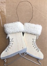 Pair of Ice Skates. Made Of Wood Aluminum Blades And Metal Hanger.