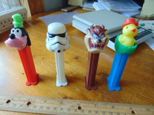 4 PEZ containers- Made in Hungary- Boda Fett, Goofy, Taz, Chick in Egg - Picture 1 of 4