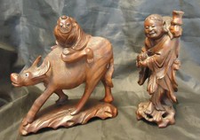 Two Vintage Asian Rosewood Statues - Man Riding Water Buffalo Man With Fish