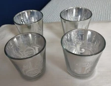 4 Rite Aid T-Lite Holders With Tidings Of Comfort & Joy Written On Them. 