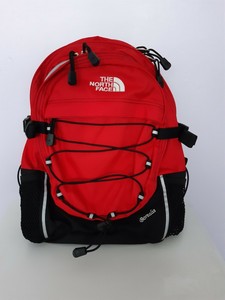 red and black north face backpack