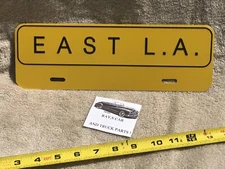 NEW EAST L.A. ( EAST LOS ANGELES )  UNIVERSAL LICENSE PLATE TOPPER .