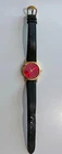 Woman's Seiko Quartz Wristwatch with red face, gold bezel and black leather band