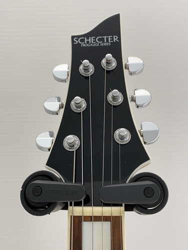 Black SCHECTER PA-SW/TH/See-Thru electric guitar with silver hardware and six-string neck, positioned against a neutral background.