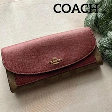 COACH Coach long wallet signature metallic burgundy x brown