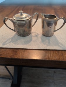Silver-plated creamer and sugar bowl set marked 'Amsterdam Silver Co...