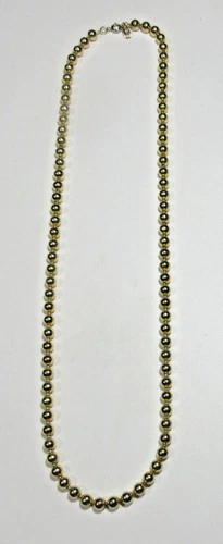 VTG SIGNED SYMBOL 25" long METAL BEADS Gold tone strand Necklace Costume Jewelry