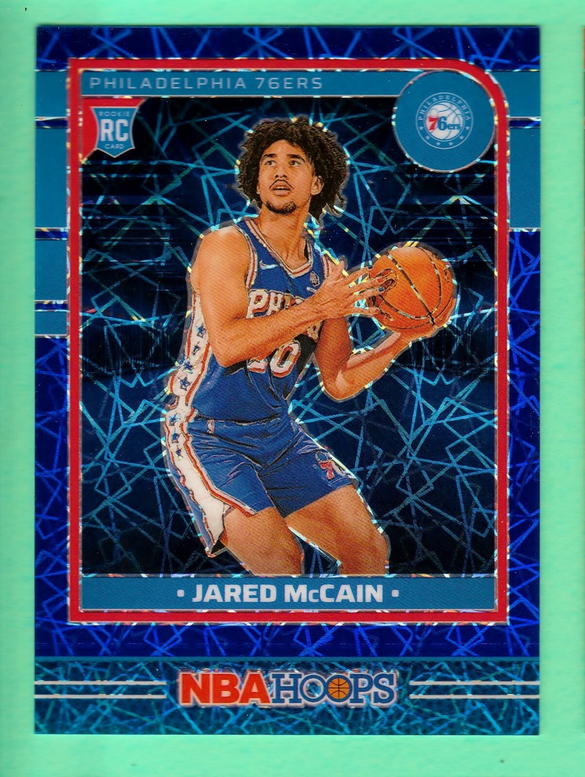 2024-25 NBA Hoops 246 Jared McCain RC Premium Blue Lazer 28/49 76ers