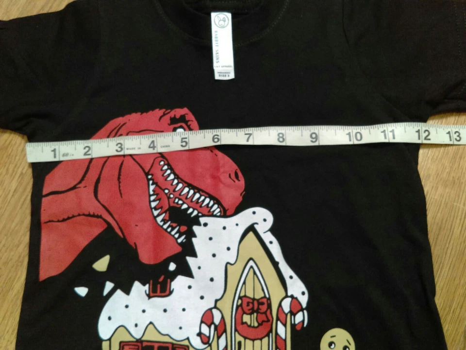 Camiseta 2 Pieles de Conejo Dinosaurio Negro Comer Pan de Jengibre Hombre Casa Niños Pequeños Foto 4 de 4