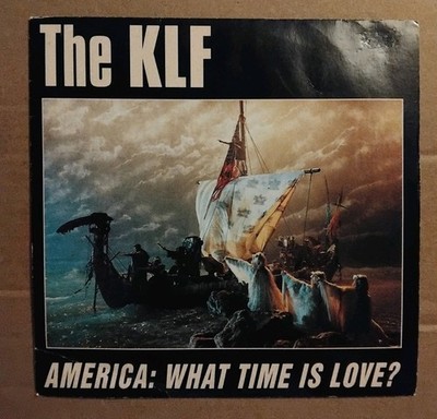 The KLF - America: What Time Is Love.  7''Single 1992. EX/VG+