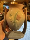 A vintage Hull Art Pottery 'Tulip' line vase with pink and blue glaze.