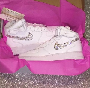 white nike air force with pink tick