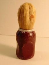 vintage shaving brush with maroon or dark red wooden handle