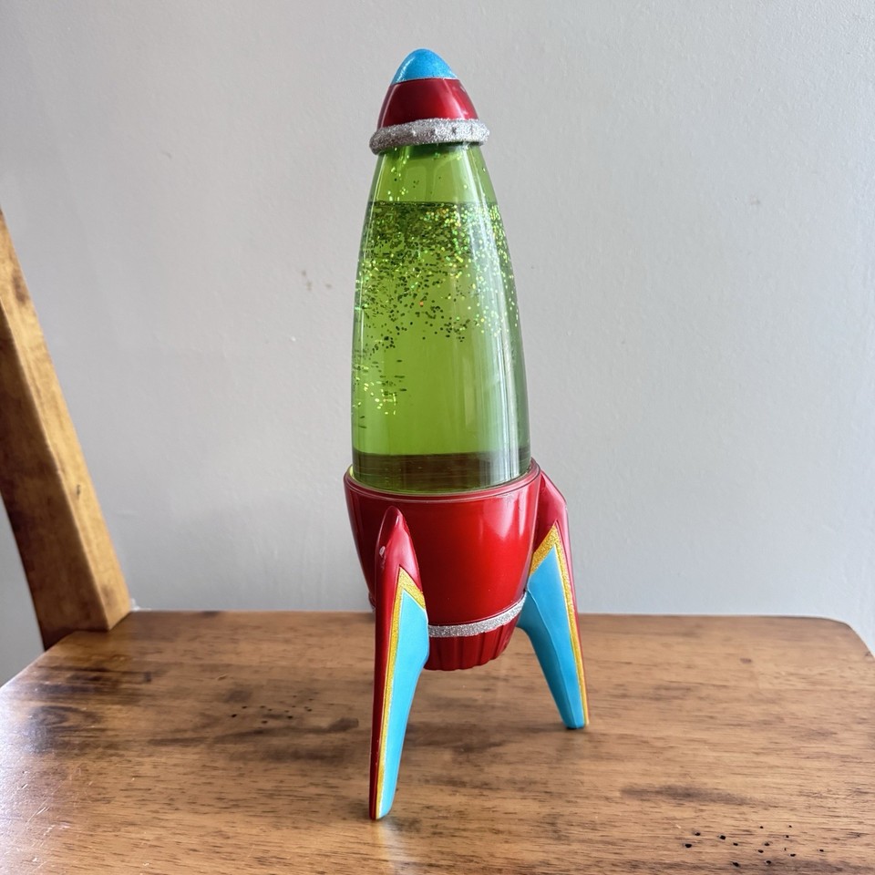 A working 1950s-style Space Age glitter rocket lava lamp — peak Atomic Age kitsch in verified working condition.