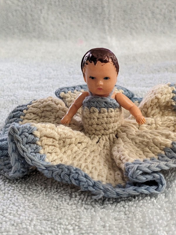 4 3/4" Celluloid girl doll Knitted dress Jointed arms and legs Short brown hair