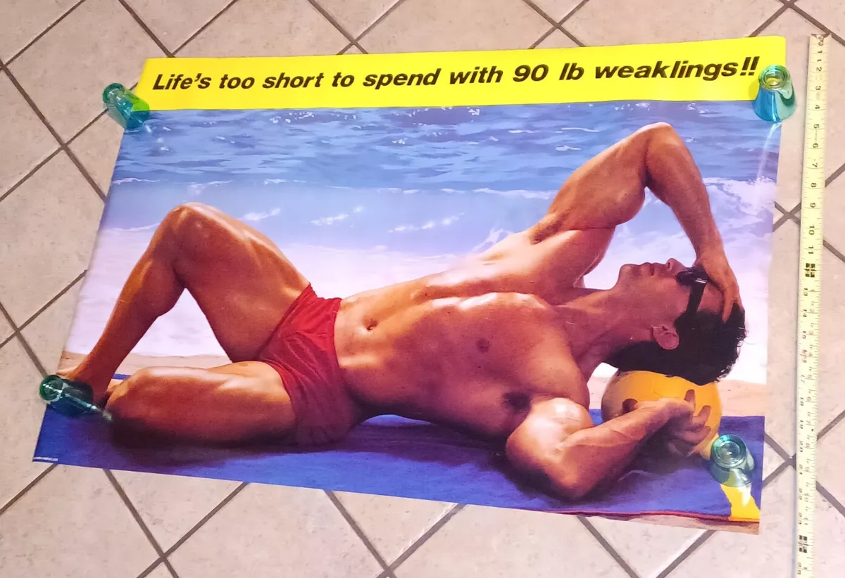 A bulky, muscular guy on the beach