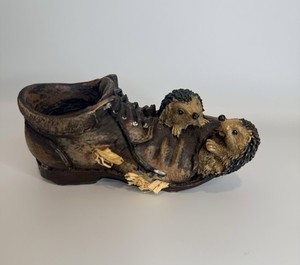 2 Hedgehogs In a Distressed Brown Boot Planter Made Of Resin By Bramble & Clover
