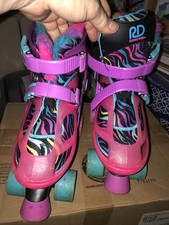 PATINES Y CUCHILLAS AJUSTABLES ROLLER DERBY NIÑAS TALLA 3-6 ROSA Y MORADO