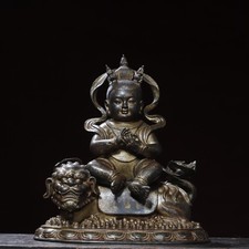 Bronze mud gold statue of a child riding a beast, Buddha statue