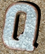 Galvanized metal letter Q in a 3D rustic style