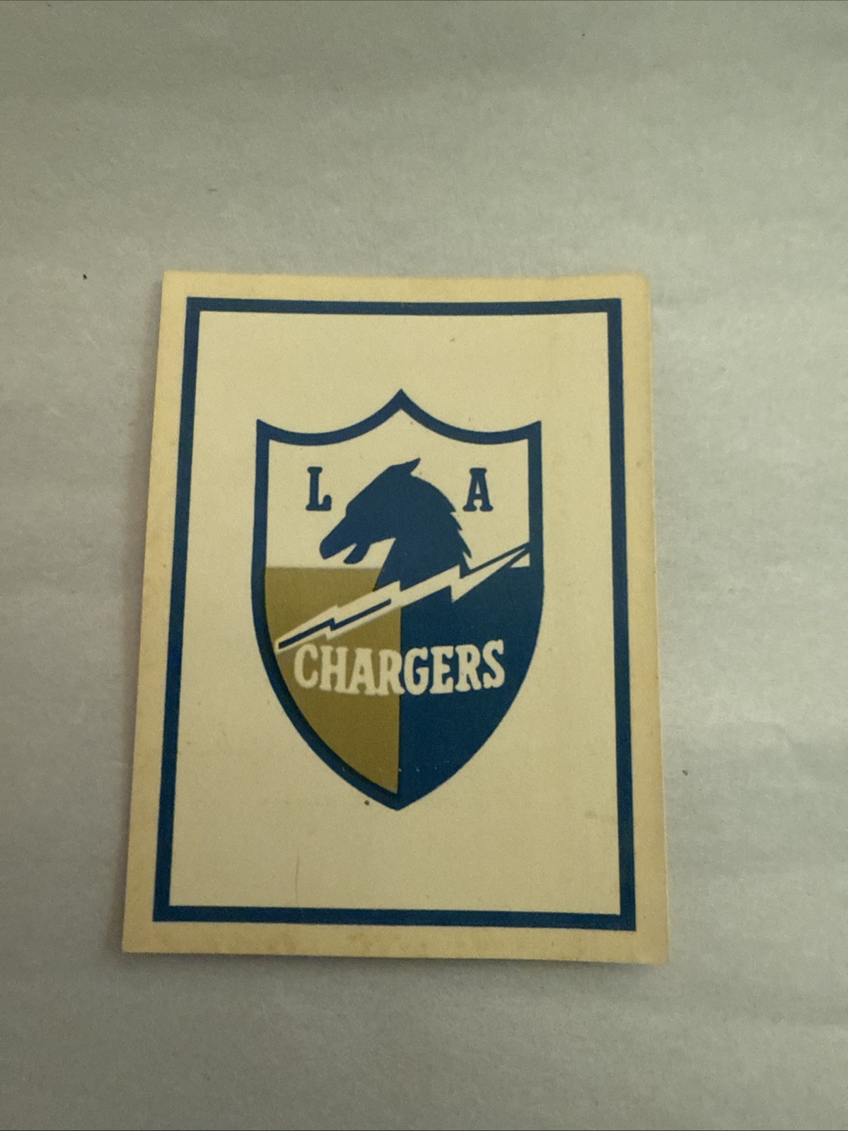 Los Angeles Chargers Football Cards 1960 Fleer AFL Team Decals trading card — raw and PSA graded price guide